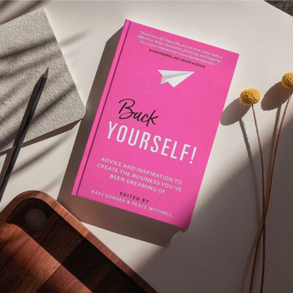 A dynamic and motivating book cover featuring the title "Back Yourself" in bold, uppercase letters against a background of vibrant colors. The cover showcases an individual standing confidently with arms raised, symbolizing self-assurance and resilience. The design exudes a sense of empowerment, encouraging readers to trust in their abilities and take bold steps towards achieving their goals.